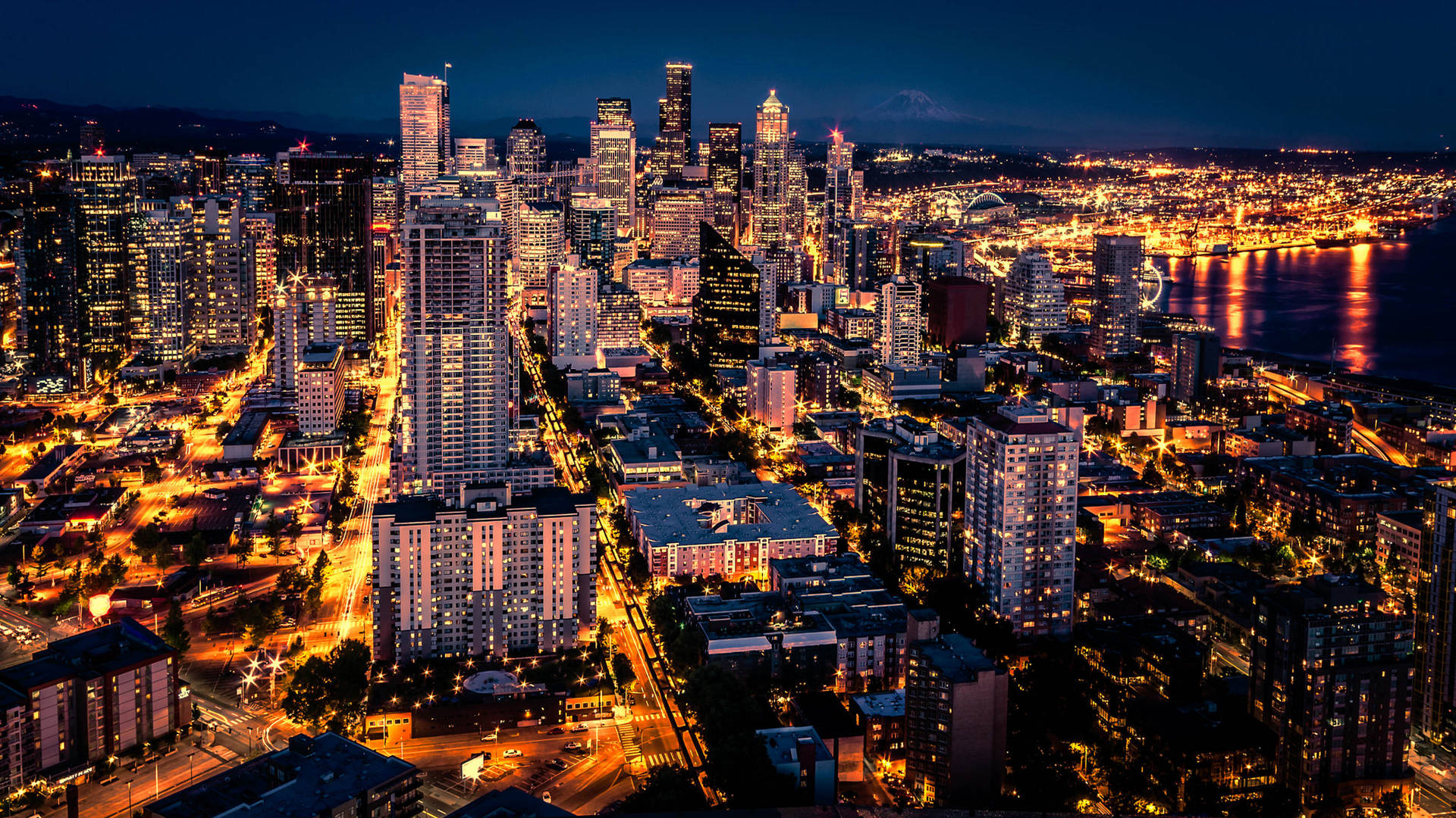 Caption: Stunning Night View of Seattle Skyline Wallpaper