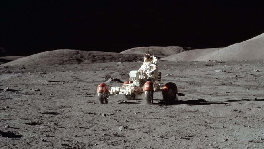 Astronaut Exploring the Moon with Lunar Rover Wallpaper
