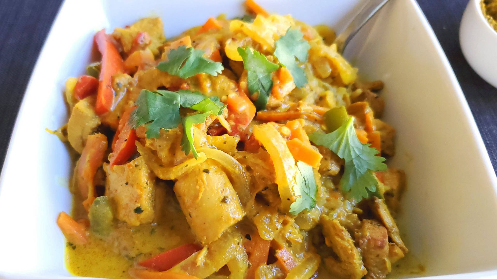 Luscious Yellow Curry Topped With Coriander Wallpaper