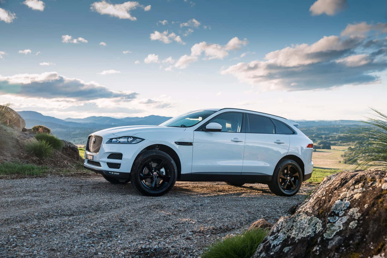 Luxurious Jaguar F-pace On Modern City Streets Wallpaper