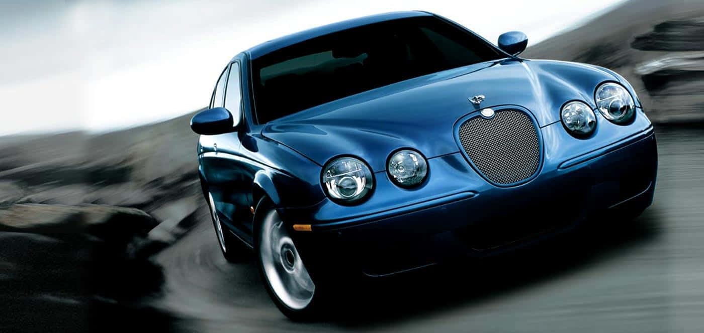 Luxurious Jaguar S-type In An Urban Backdrop Wallpaper