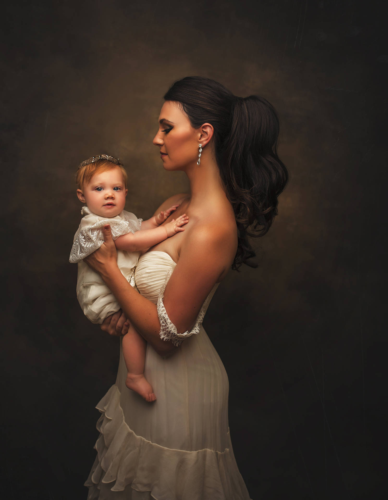 Caption: A precious moment between Mother and Baby in a luxurious studio shoot. Wallpaper