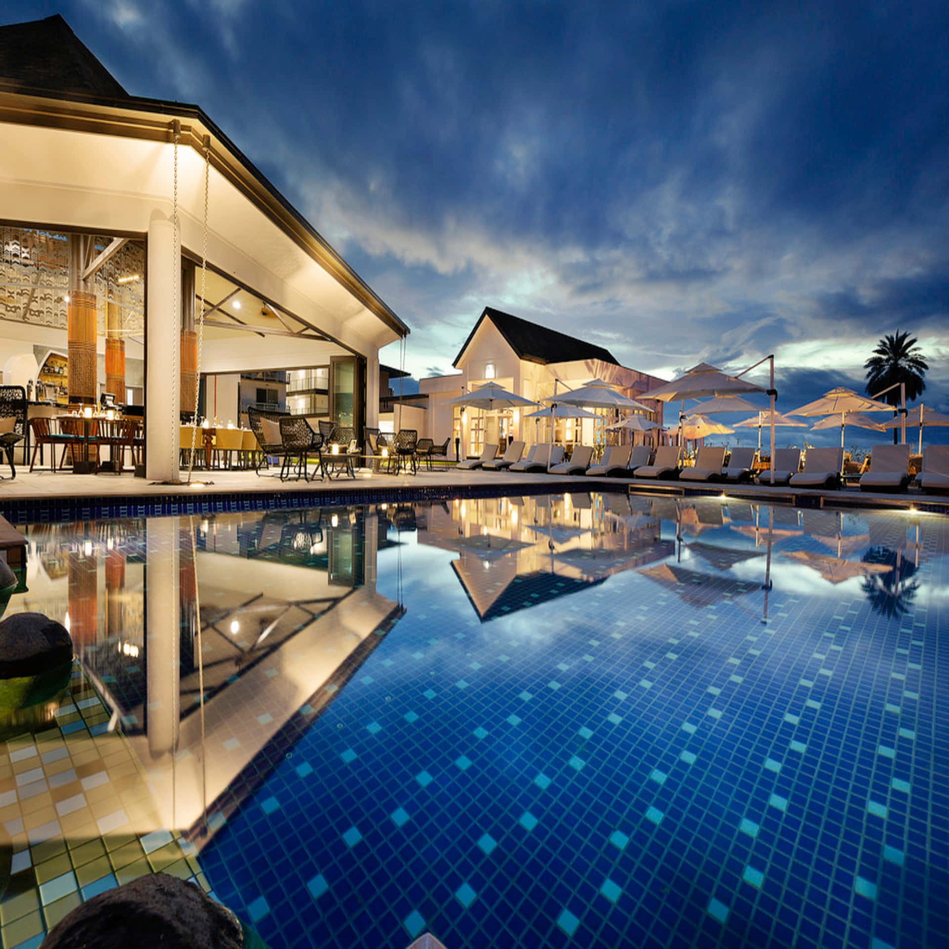 Luxurious Pool Resort Nighttime. Wallpaper