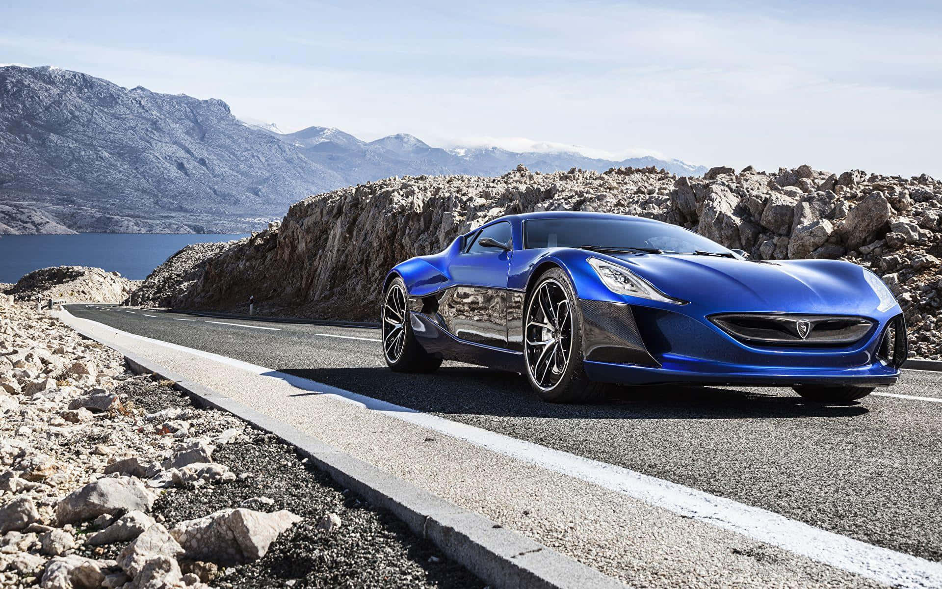 Luxurious Rimac Concept One Cruising On A City Road Wallpaper