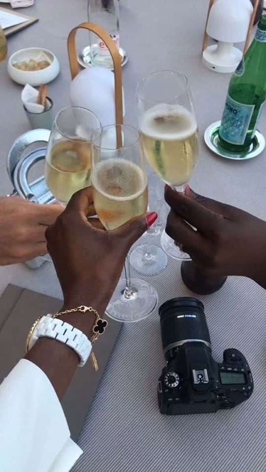 Luxury Champagne Celebration With Camera Wallpaper