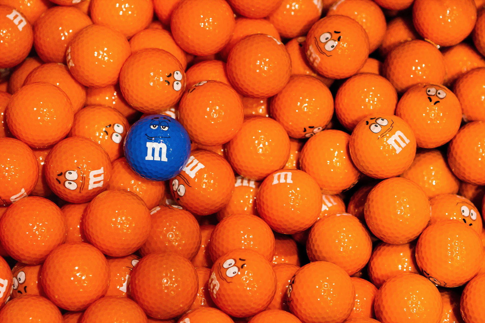 Enhance your game with these colourful M&M Golf Balls Wallpaper