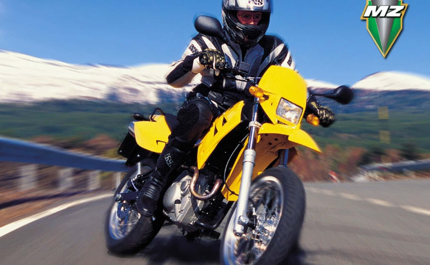 M Z Motorcycle Speeding Past Mountain Wallpaper