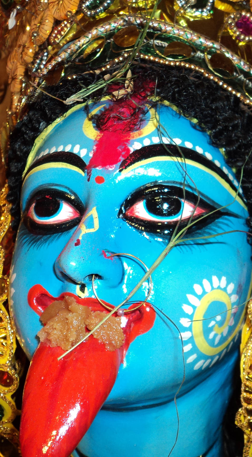 Maa Kali Blue Statue With Tongue Close-Up Wallpaper