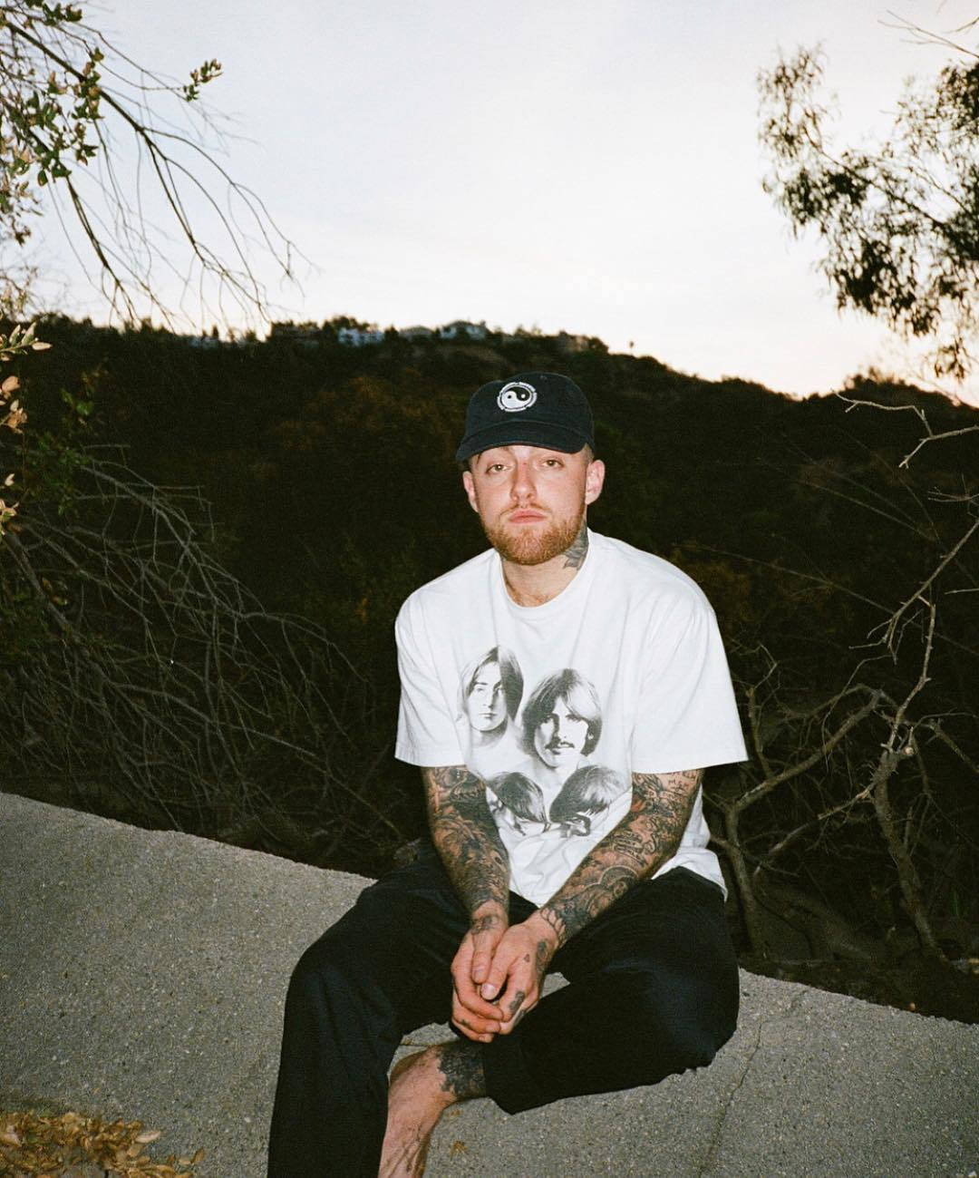 Mac Miller On Ledge With View Wallpaper