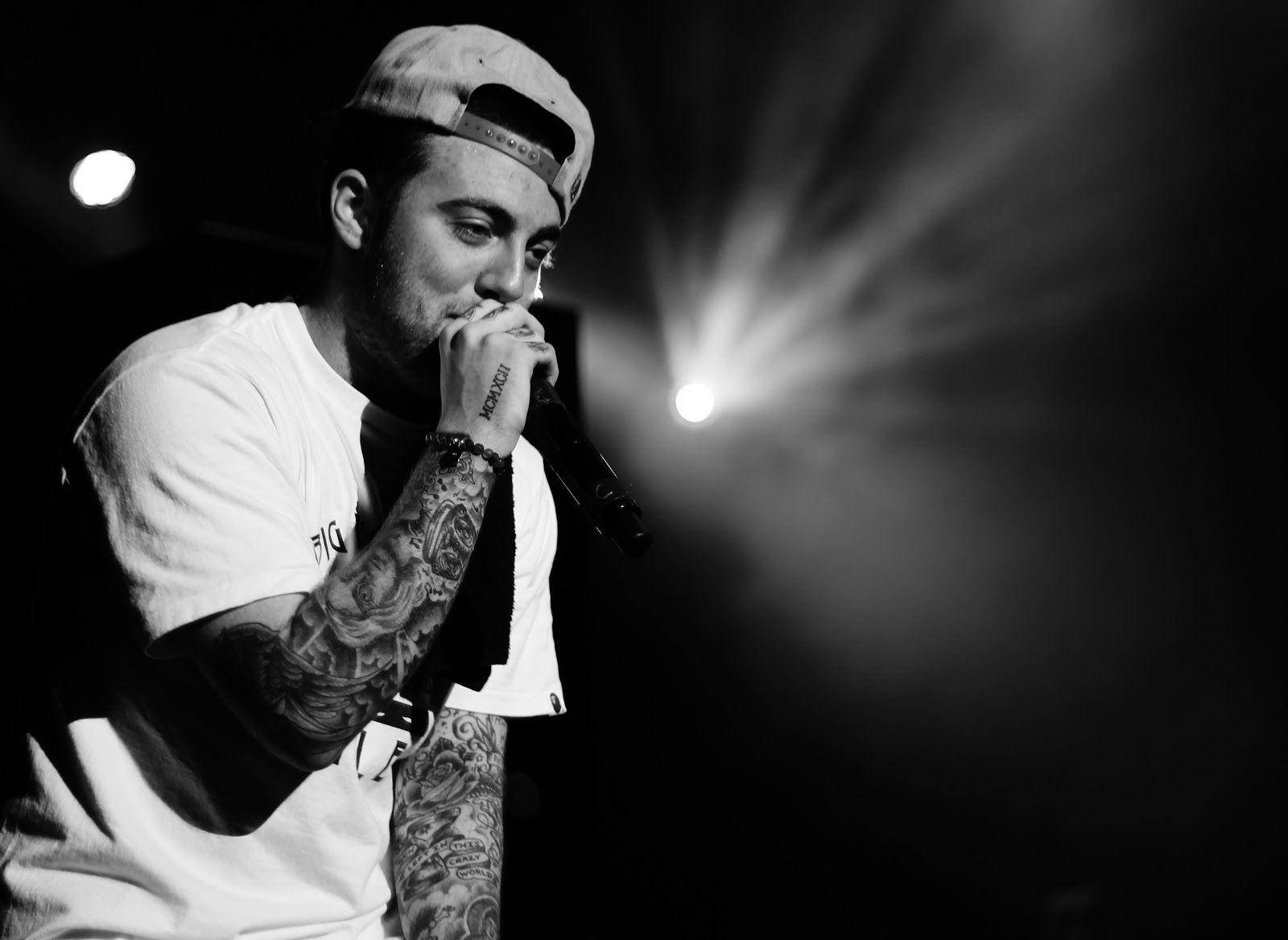 Mac Miller Performing In Black And White Wallpaper
