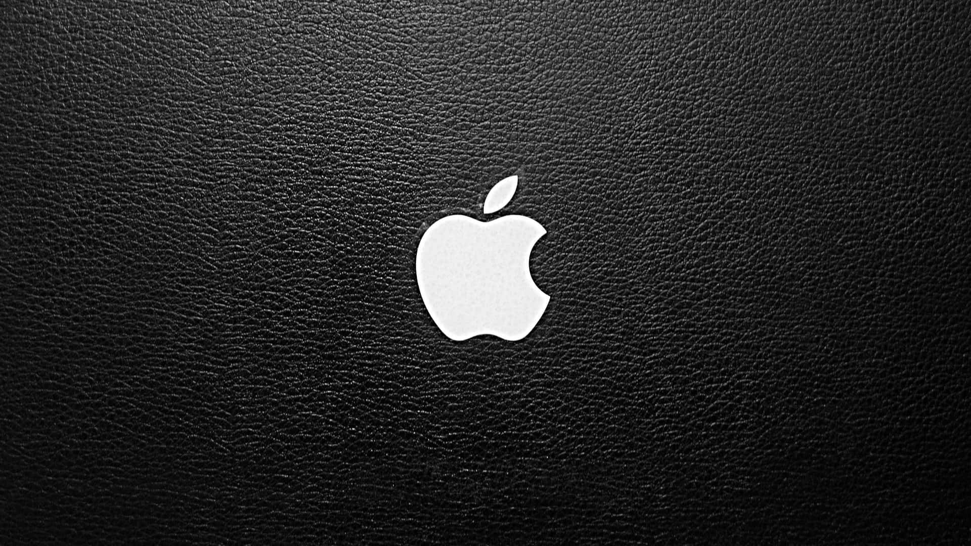 Apple Logo On A Black Leather Background