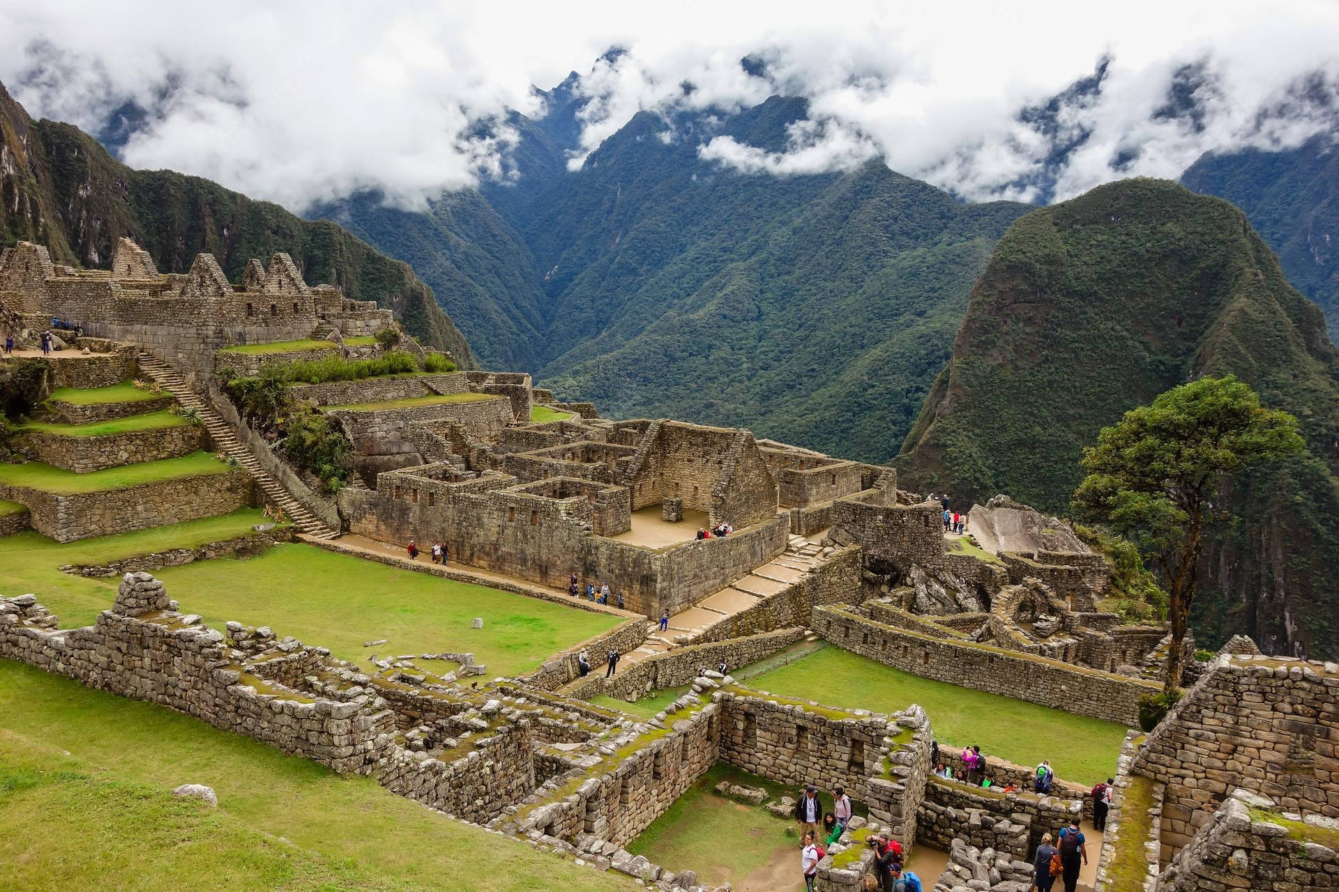Machu Picchu In Cusco Peru With Tourists Wallpaper