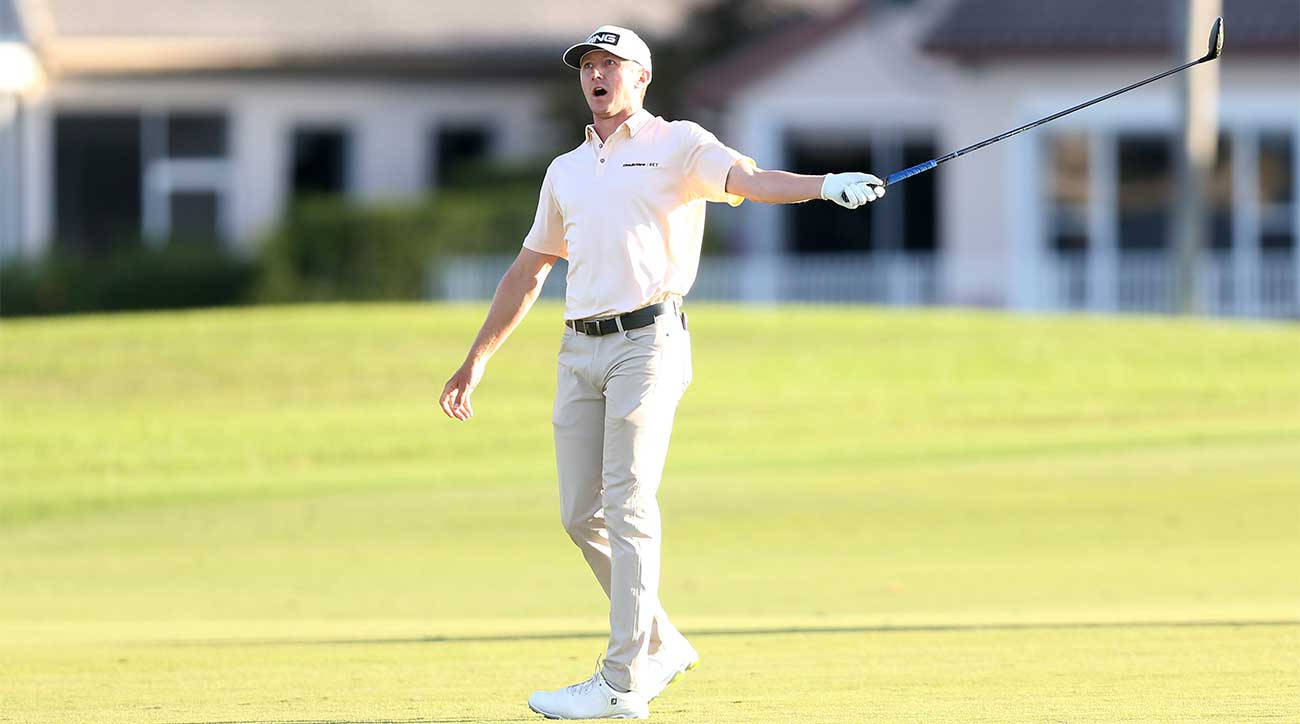 Mackenzie Hughes Pointing With Golf Club Wallpaper