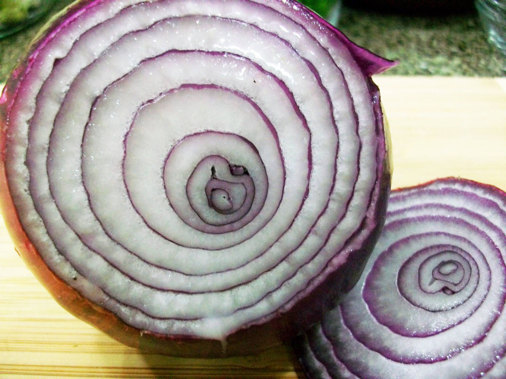 Macro Shot Of A Sliced Red Onion Wallpaper