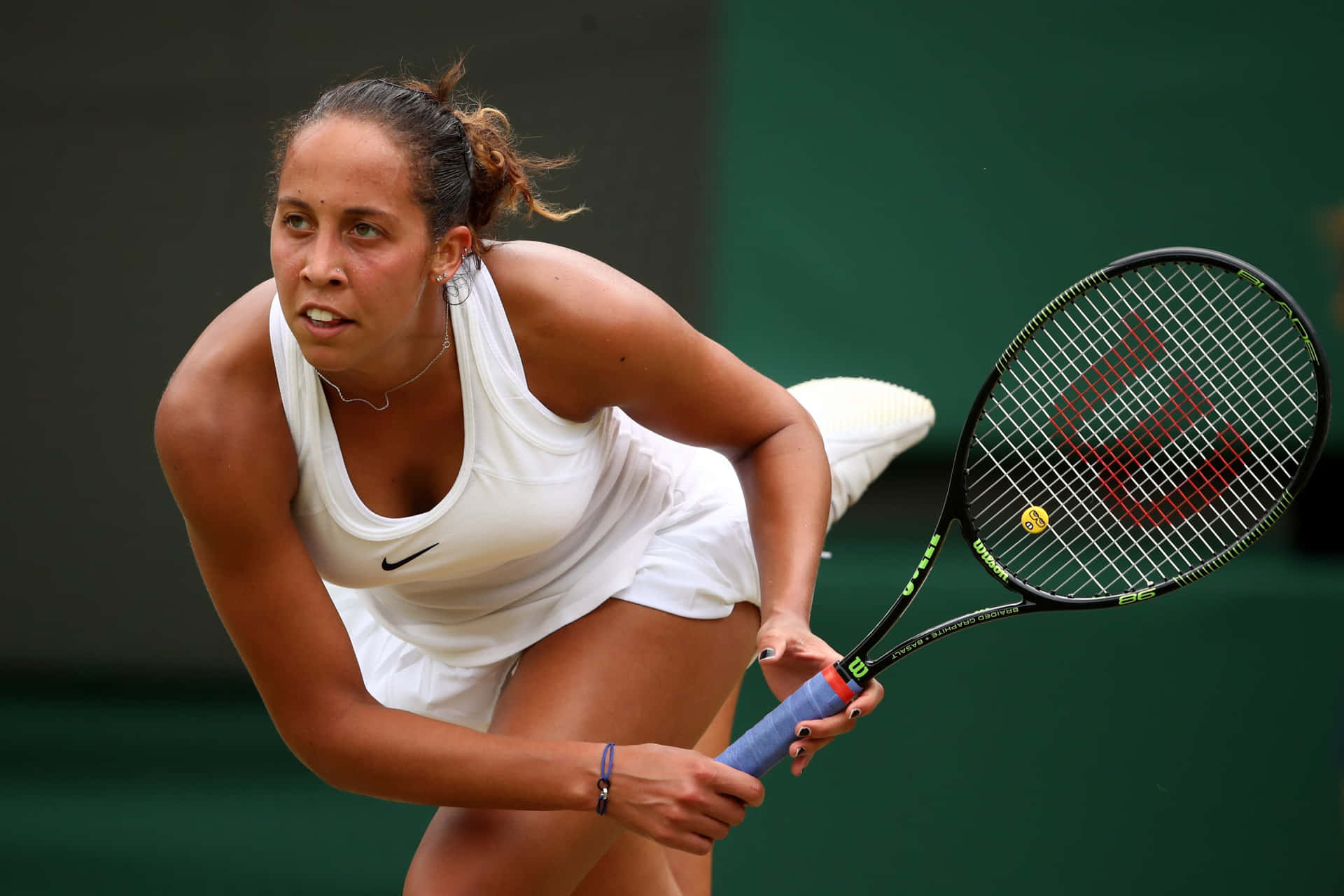 Determined Madison Keys in the Heat of the Game Wallpaper