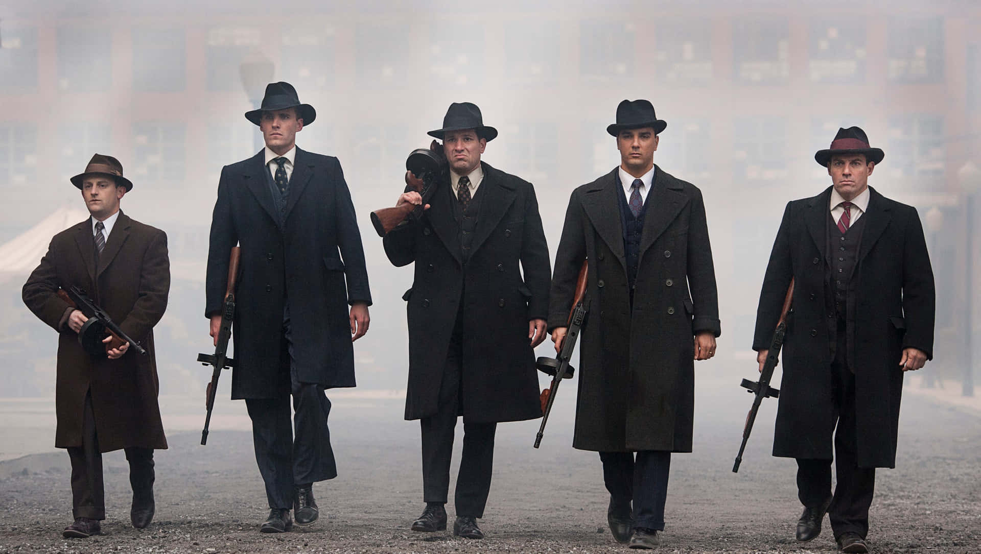 A Group Of Men In Suits And Hats Walking Down A Street