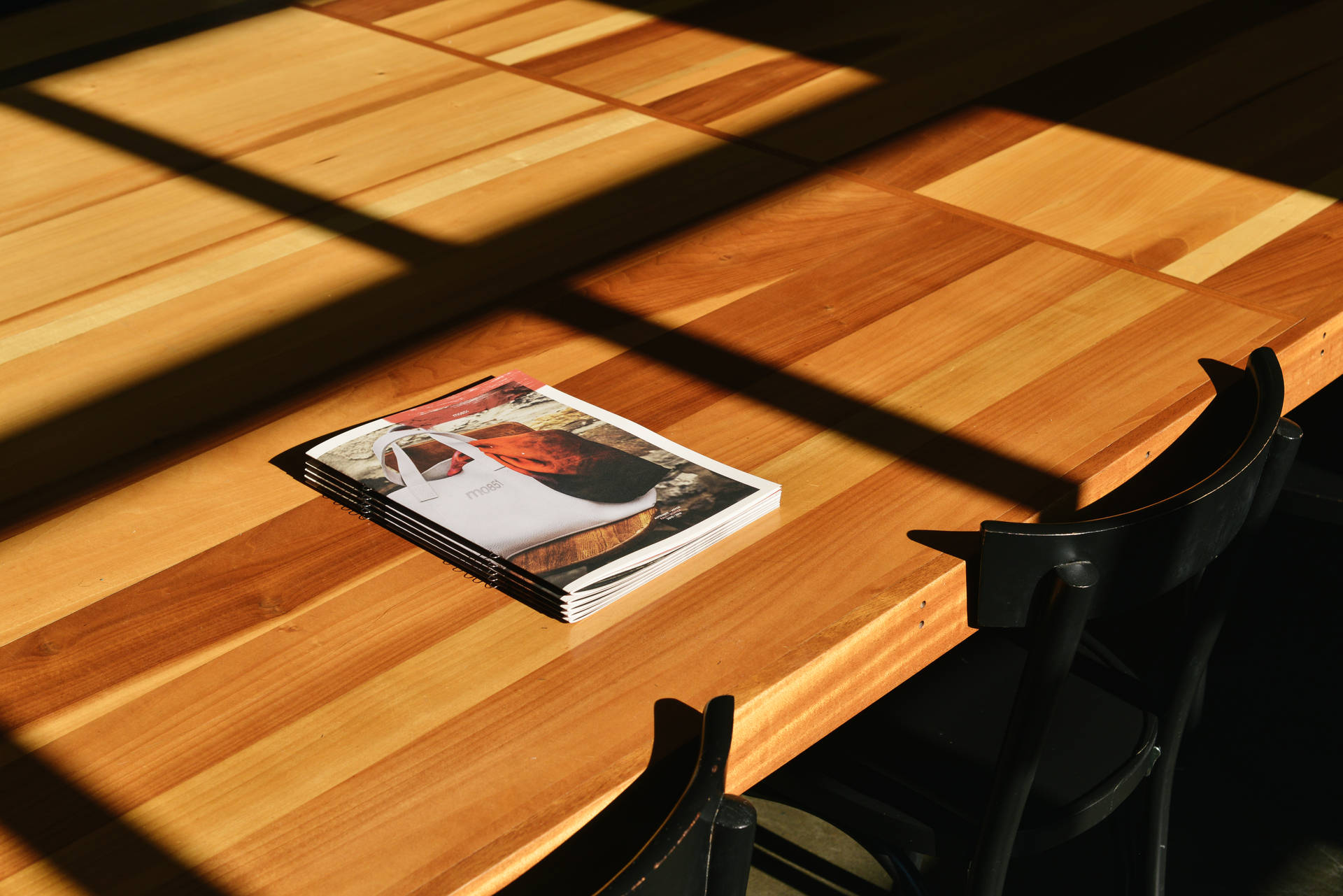 Magazine Placed On Wooden Table