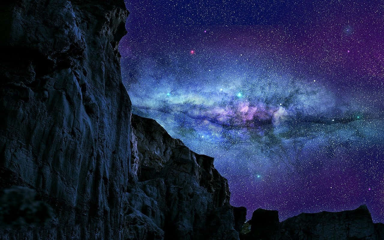 Magical Night Sky With Many Stars Over Rocky Mountains Wallpaper
