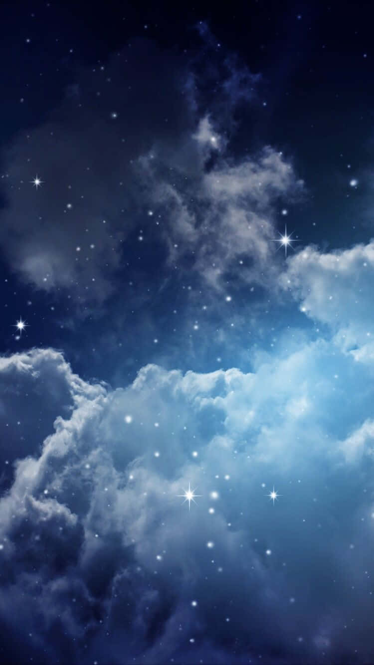 Magical Night Sky With Many Stars Shining On Large Clouds Wallpaper