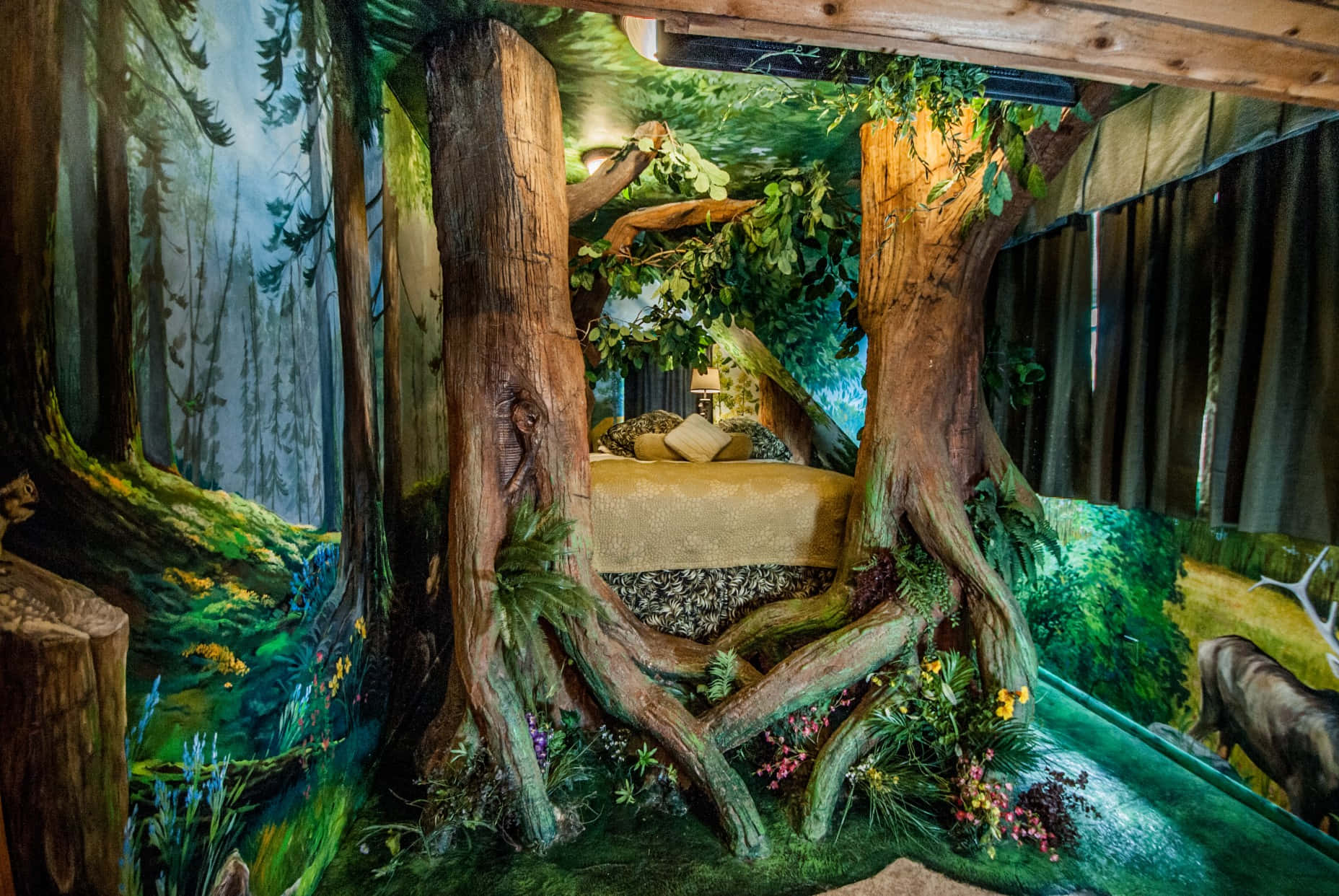 a bedroom with a tree bed and a tree trunk