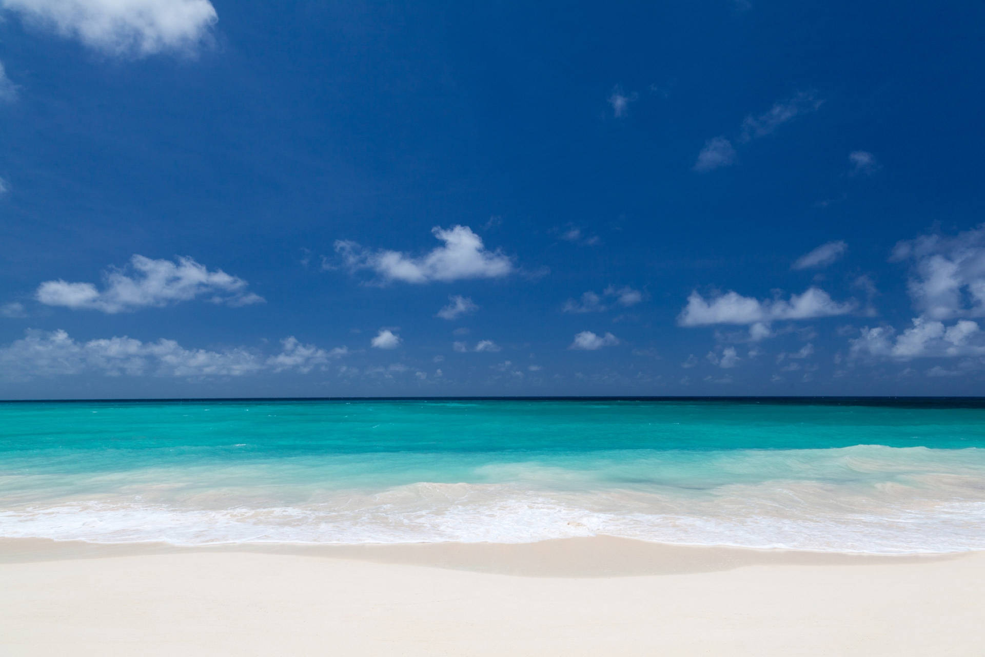 Magnificent White Beach And Blue Sky Wallpaper