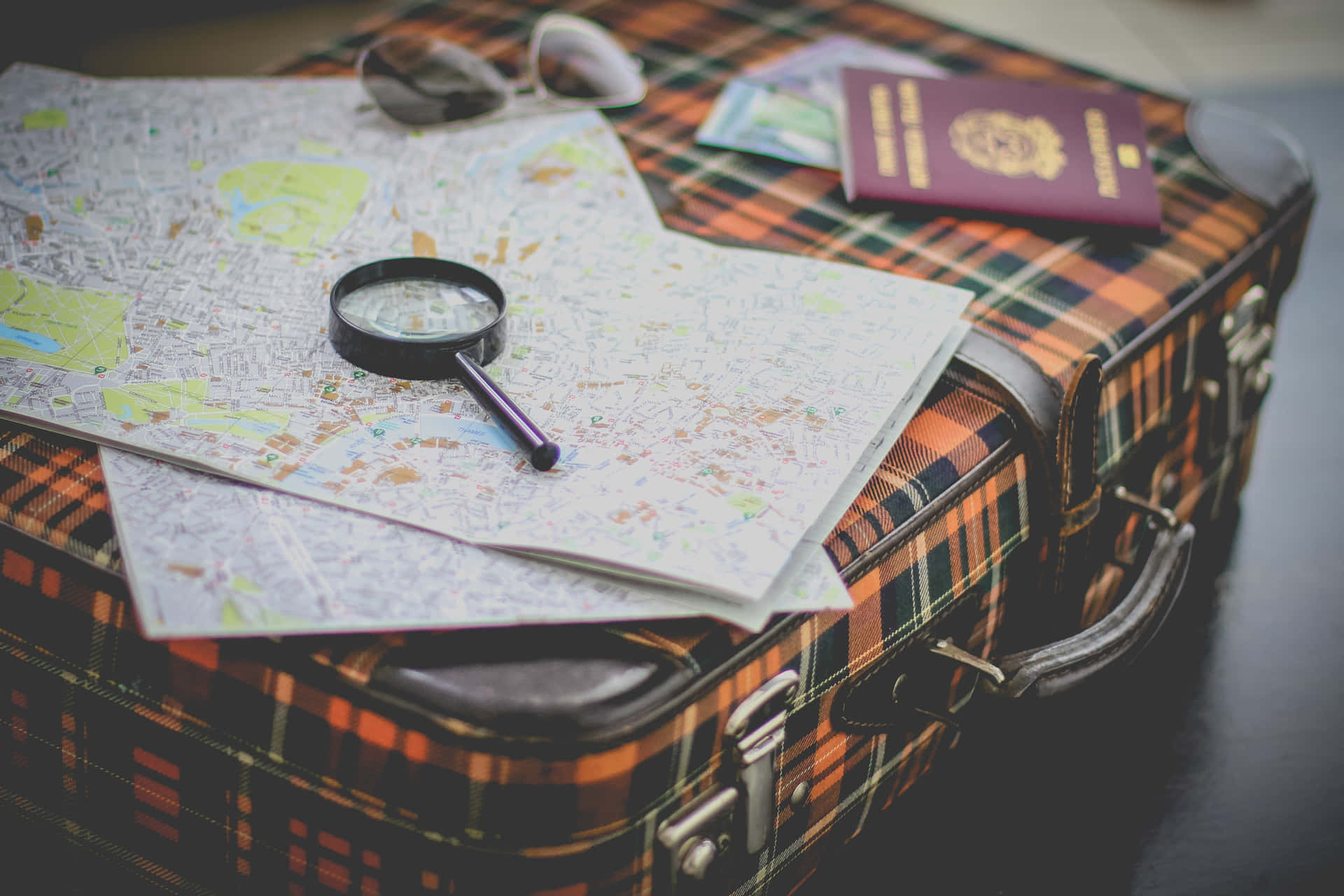Magnifying Glass Traveling Around The World Background