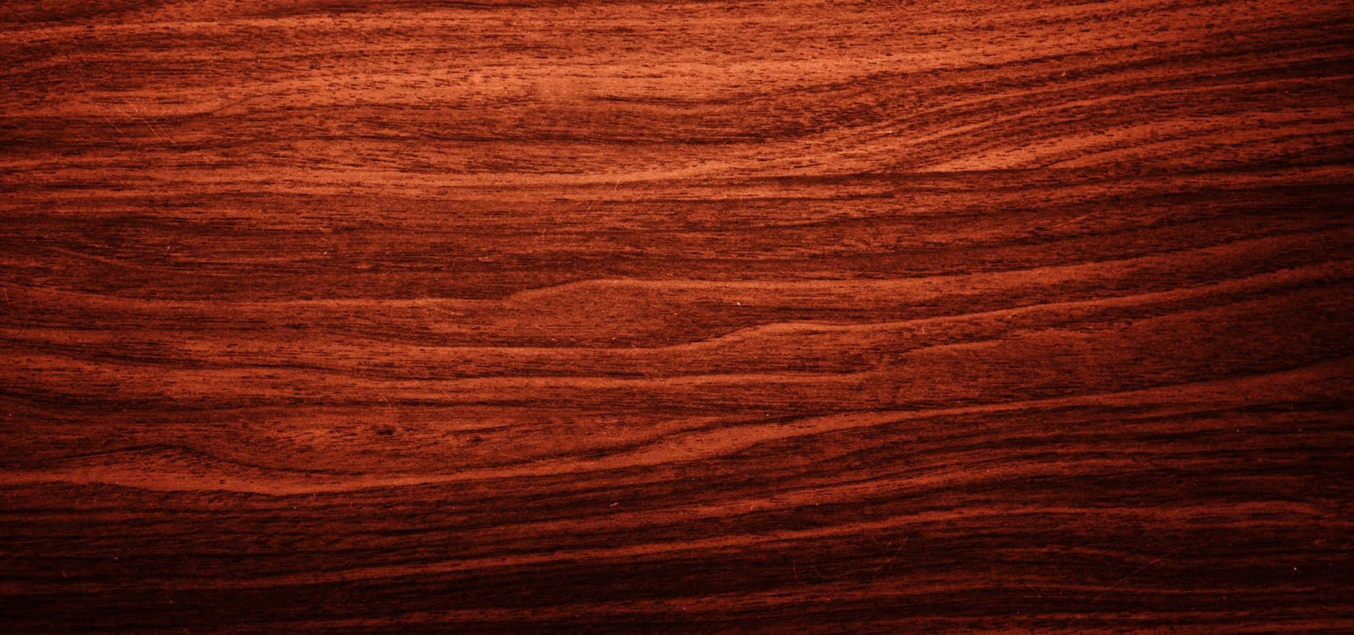 A Close-Up of Mahogany Wood Grain Texture Wallpaper