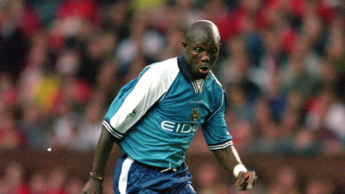 George Weah in Action at Maine Road Wallpaper