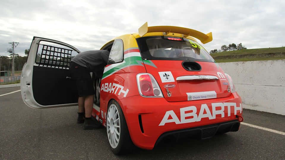 Majestic Abarth 695 Showcasing Its Torque On The Road Wallpaper