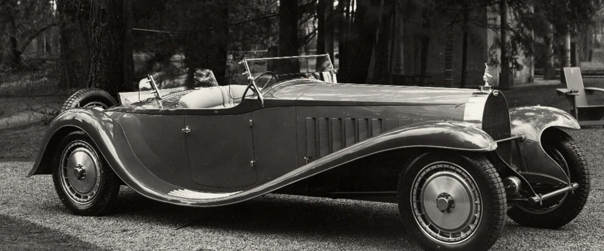 Majestic Bugatti Type 41 Royale On Display Wallpaper