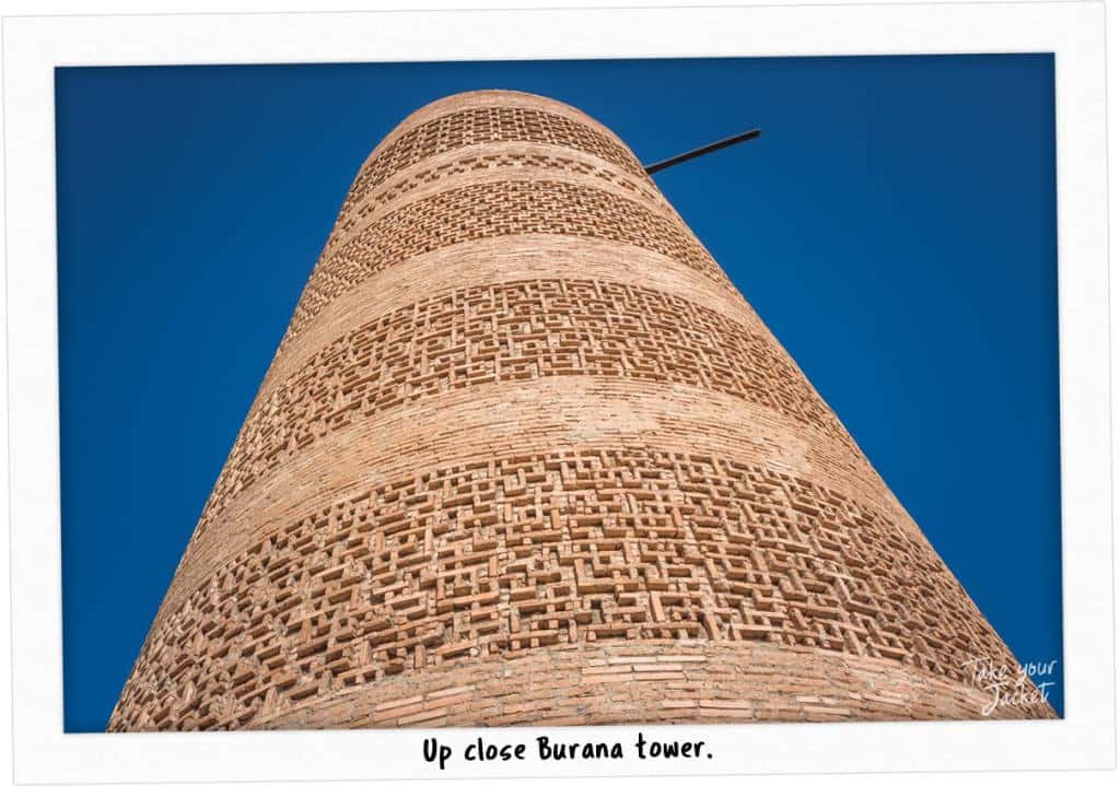 Majestic Burana Tower Against A Blue Sky Wallpaper
