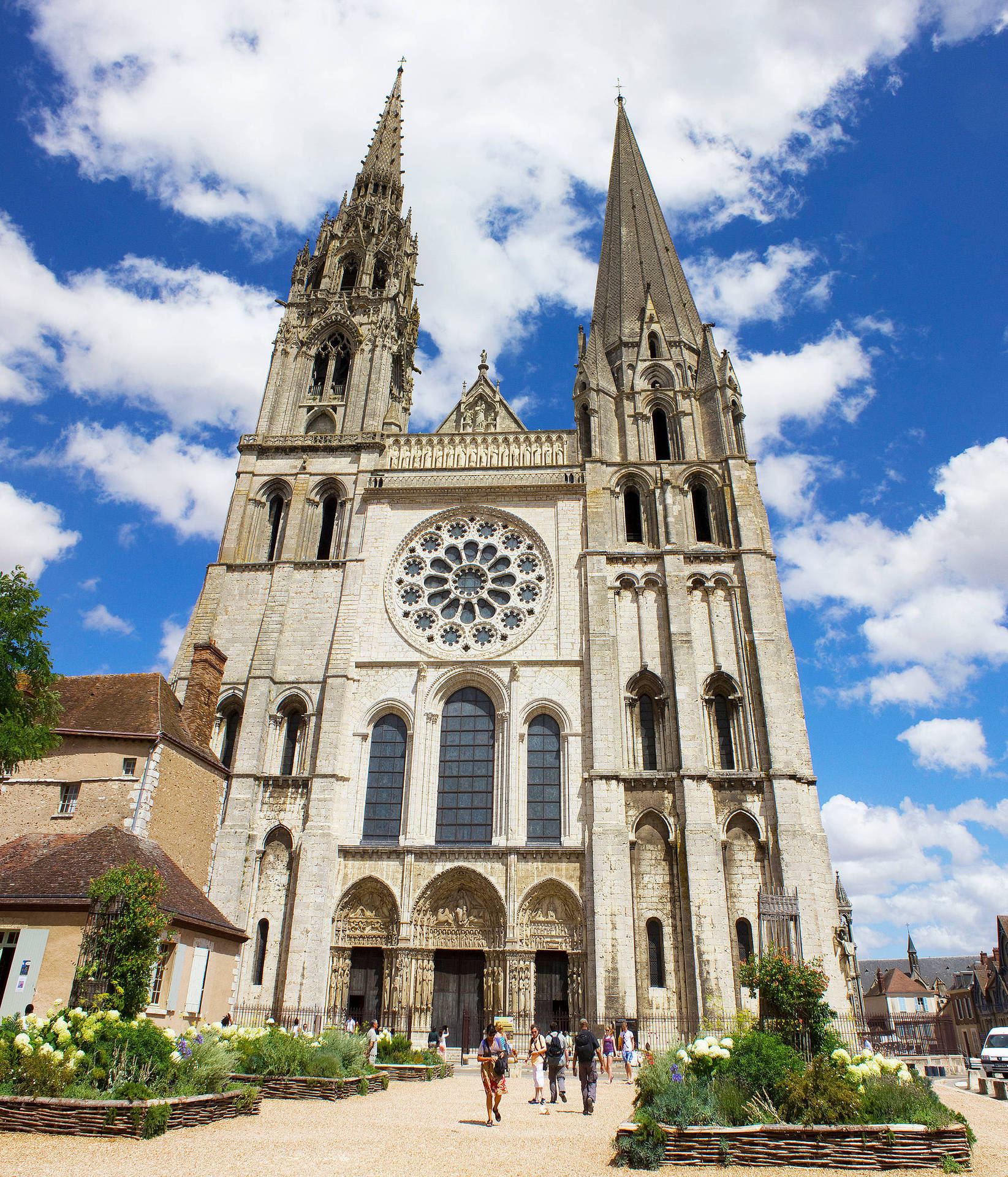 Majestic Chartres Cathedral Under The Parisian Sky Wallpaper