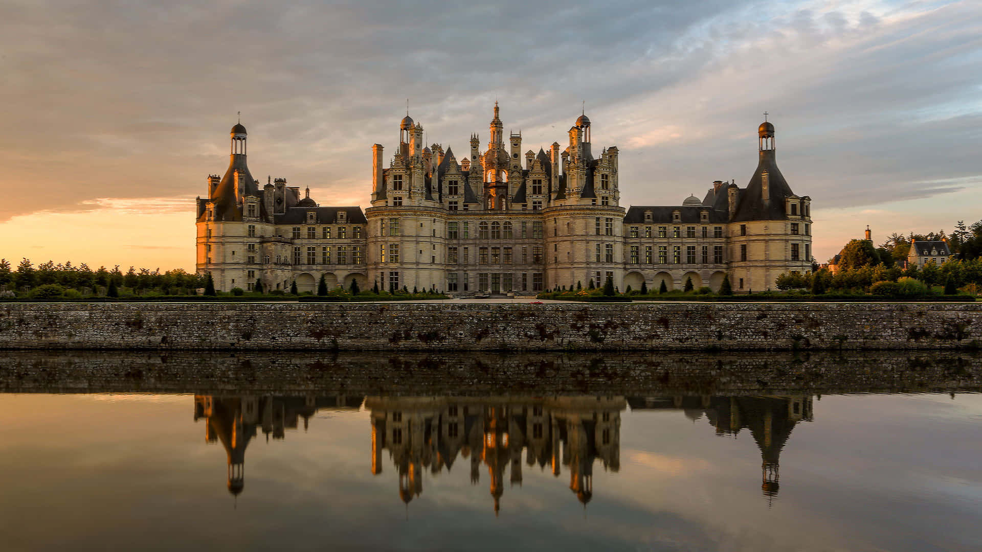 Majestic Chateau Reflectionat Sunset Wallpaper