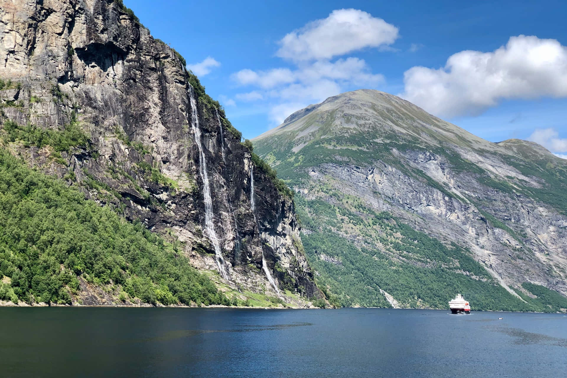 Majestic_ Fjord_ Waterfall_and_ Cruise_ Ship Wallpaper