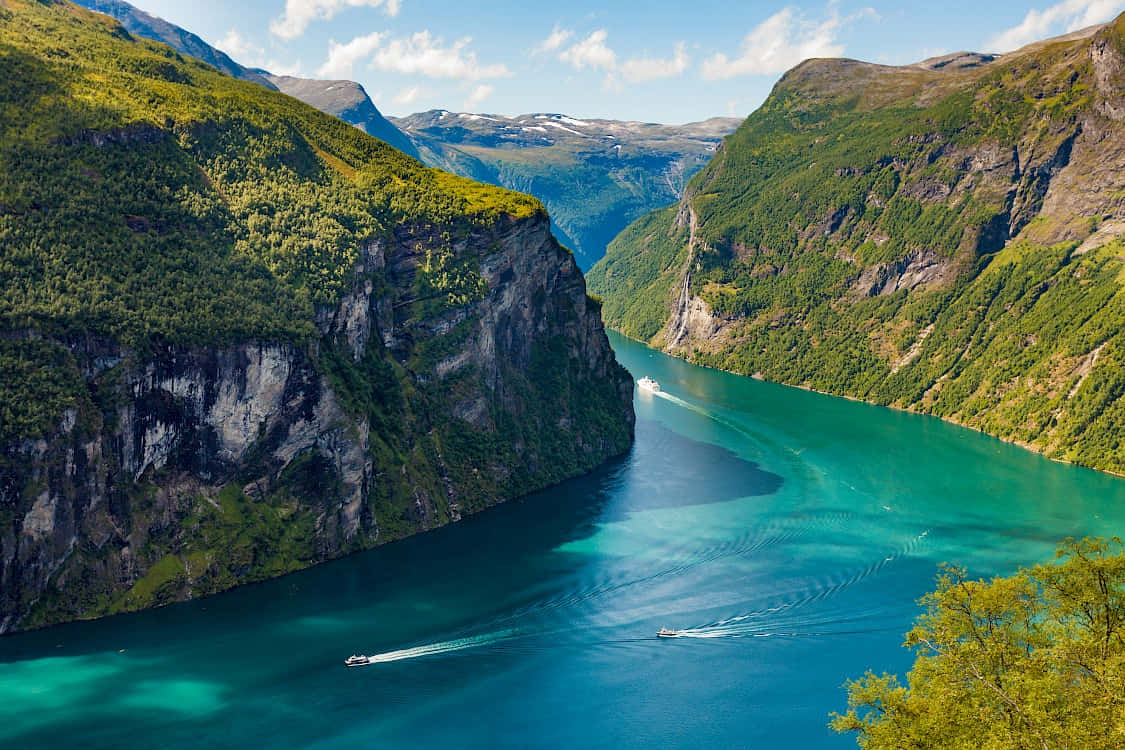 Majestic_ Green_ Fjord_with_ Boats.jpg Wallpaper