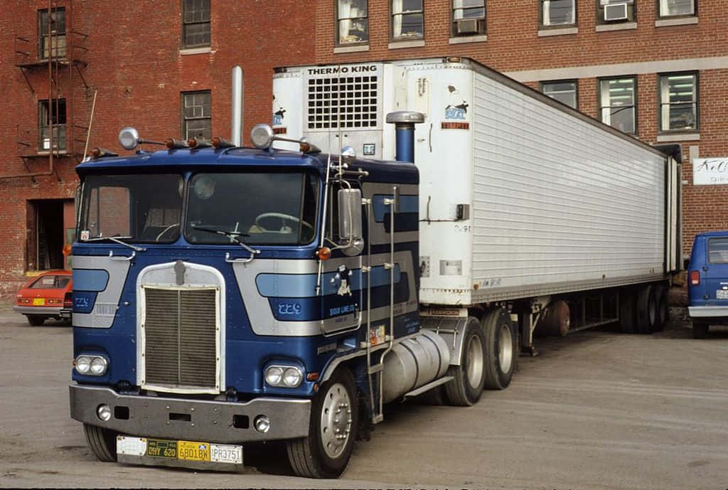 Majestic Kenworth K100 Big Rig On The Open Road Wallpaper