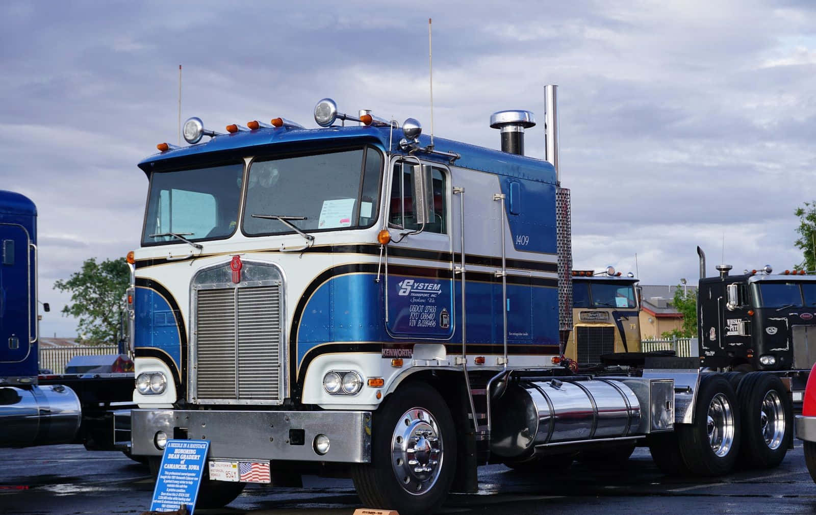 Majestic Kenworth K100 Semi Truck On The Move Wallpaper