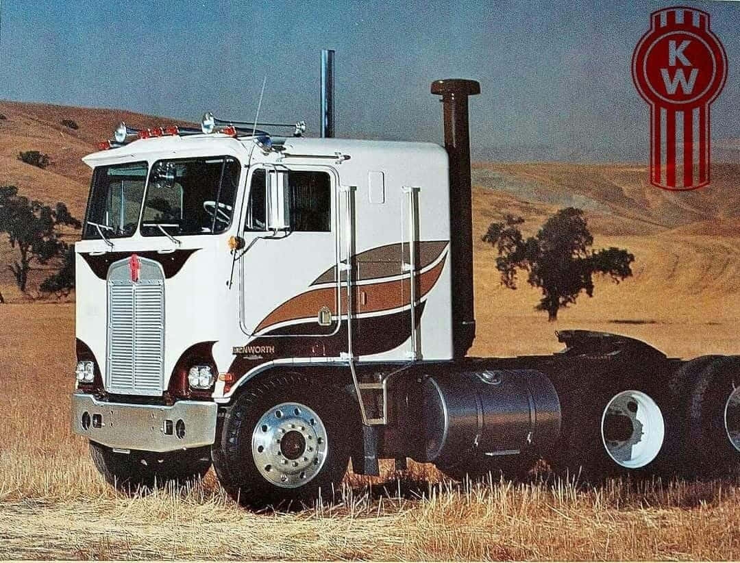 Majestic Kenworth K100 Truck On The Move Wallpaper