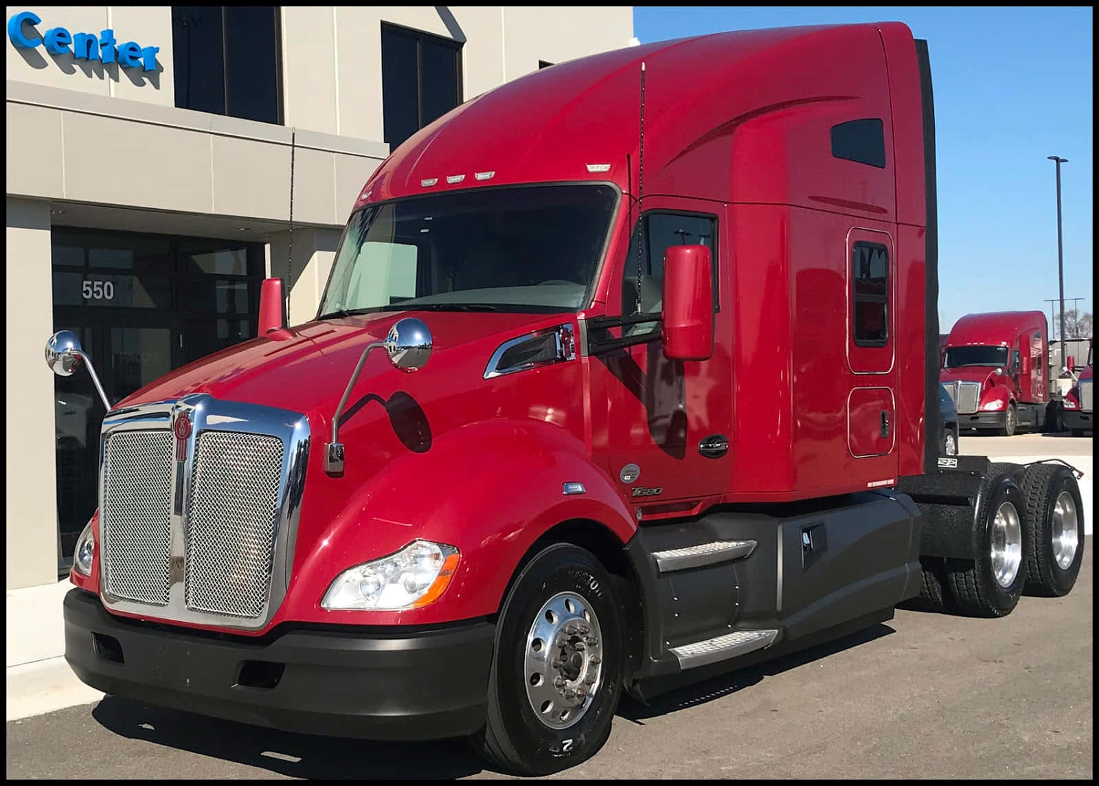 Majestic Kenworth T680 Semi-truck On The Open Road Wallpaper