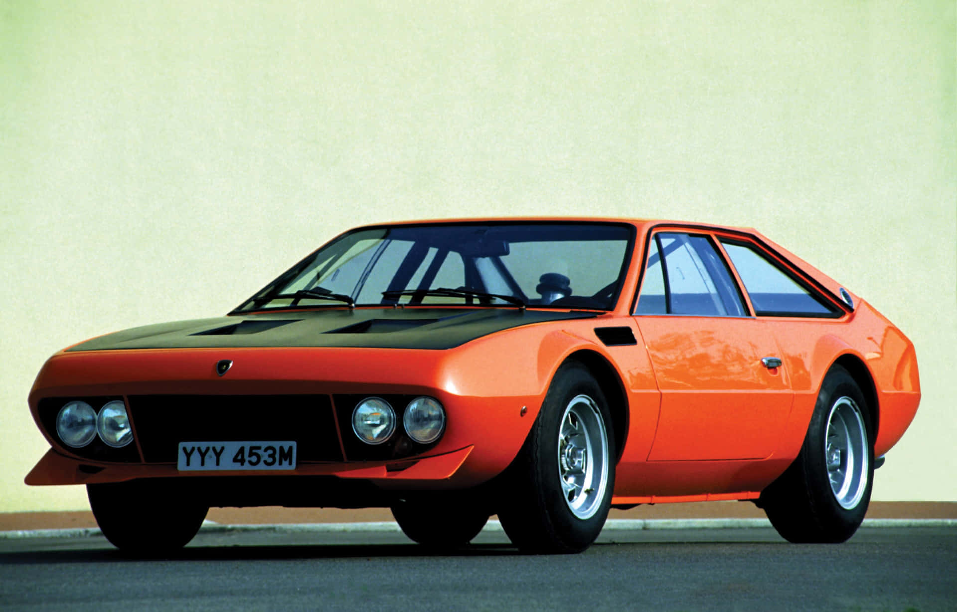 Majestic Lamborghini Jarama Under The Beautiful Sunset Wallpaper