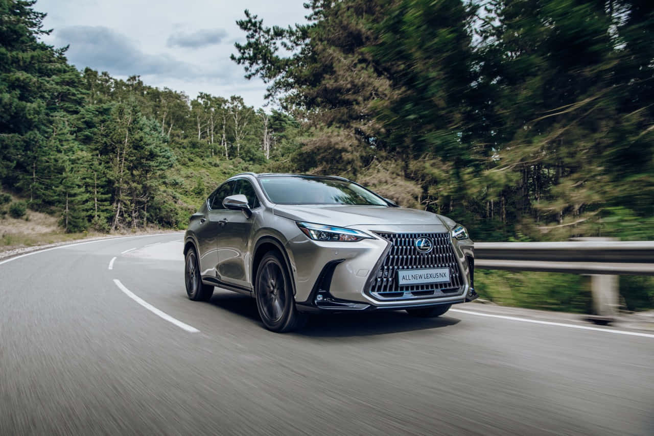 Majestic Lexus Nx Driving On A Rainy Street Wallpaper