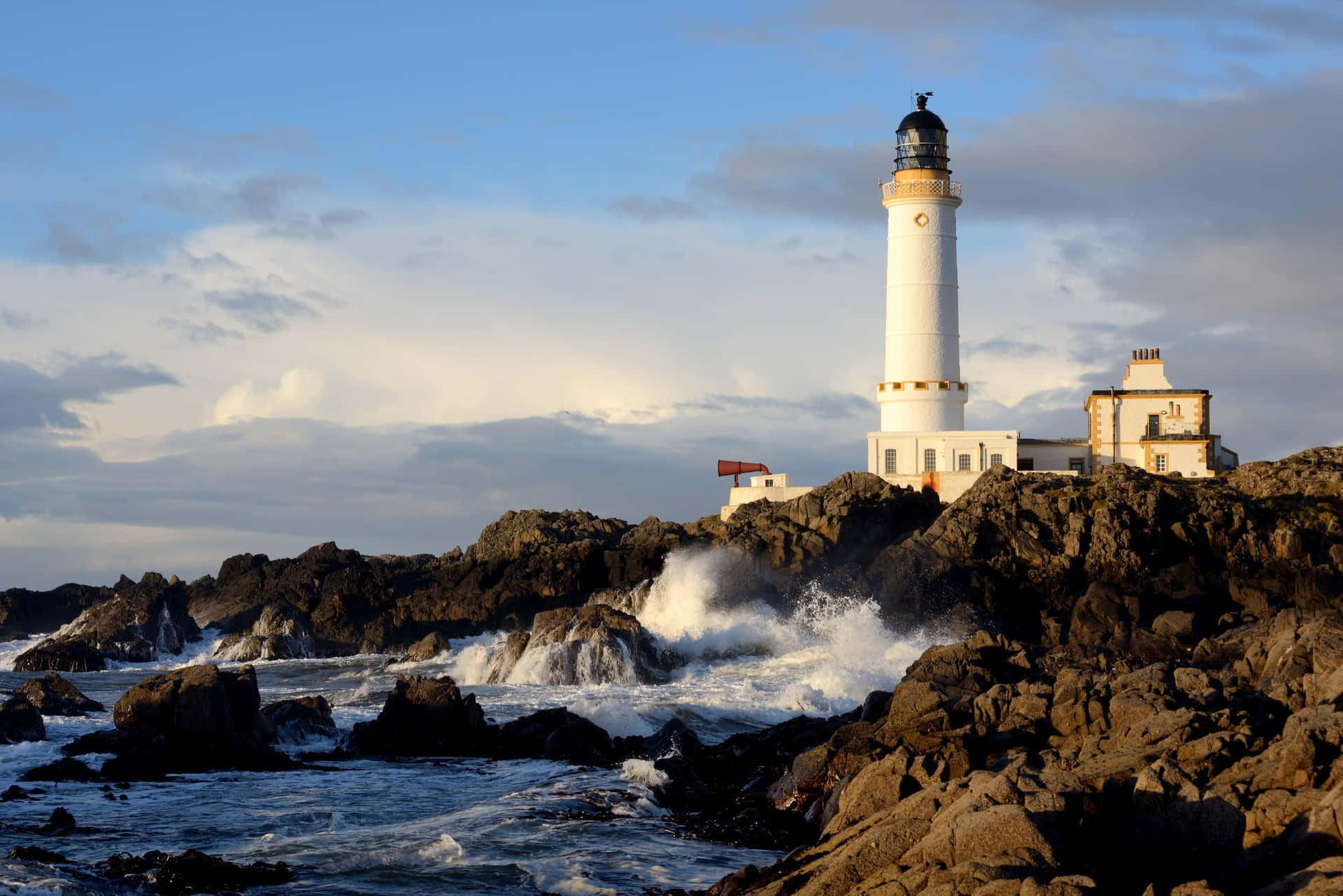 Majestic Lighthouse Illuminating The Coastal Dusk