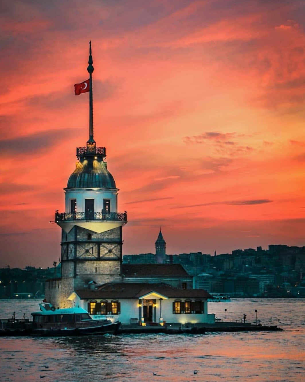 Majestic Maiden Tower Against Azure Sky Wallpaper