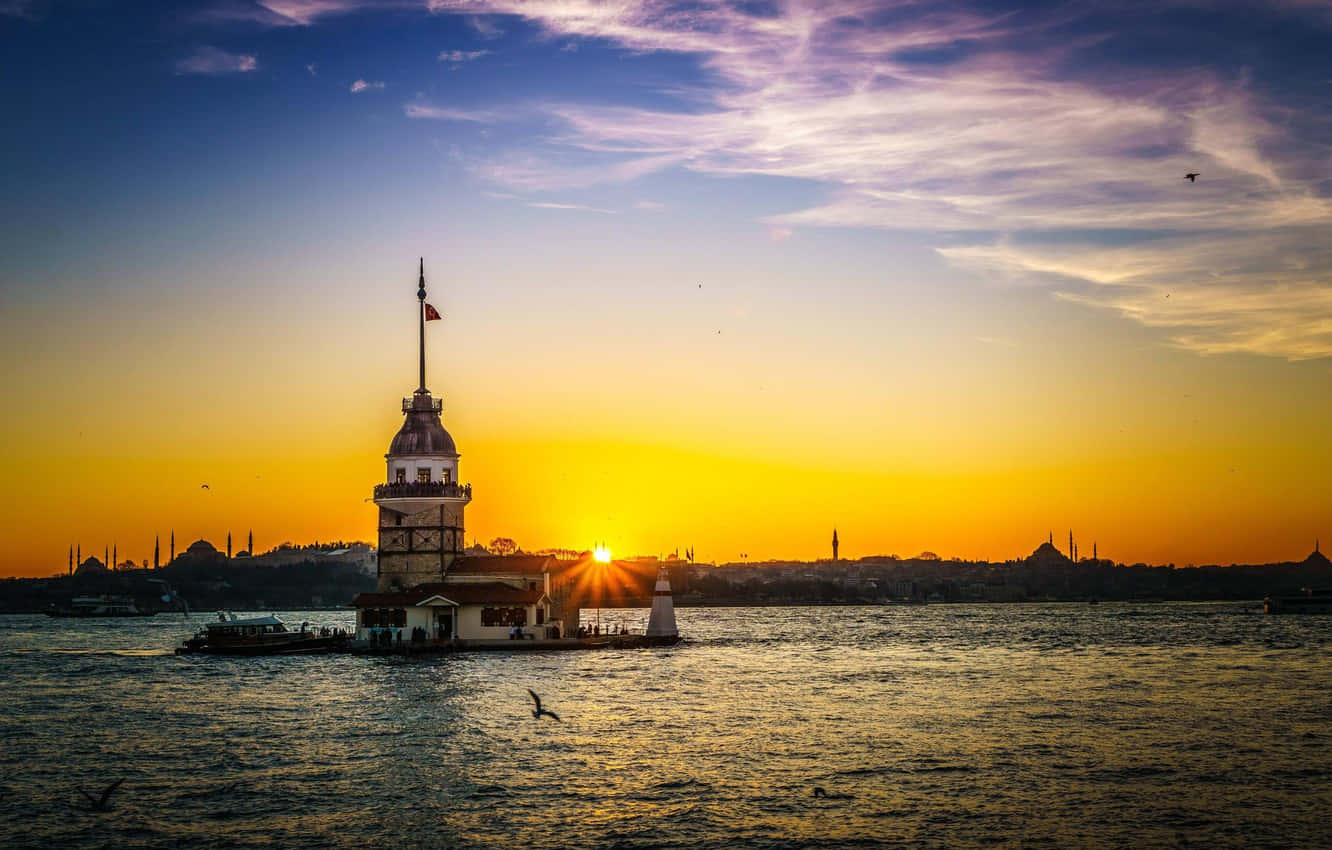 Majestic Maiden Tower At Sunset Wallpaper