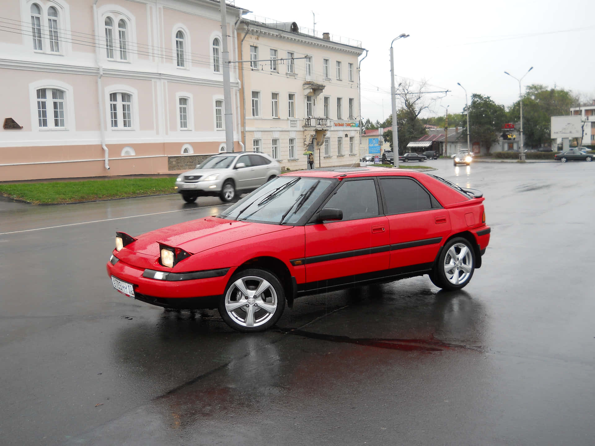 Majestic Mazda 323 In Pristine Condition Wallpaper