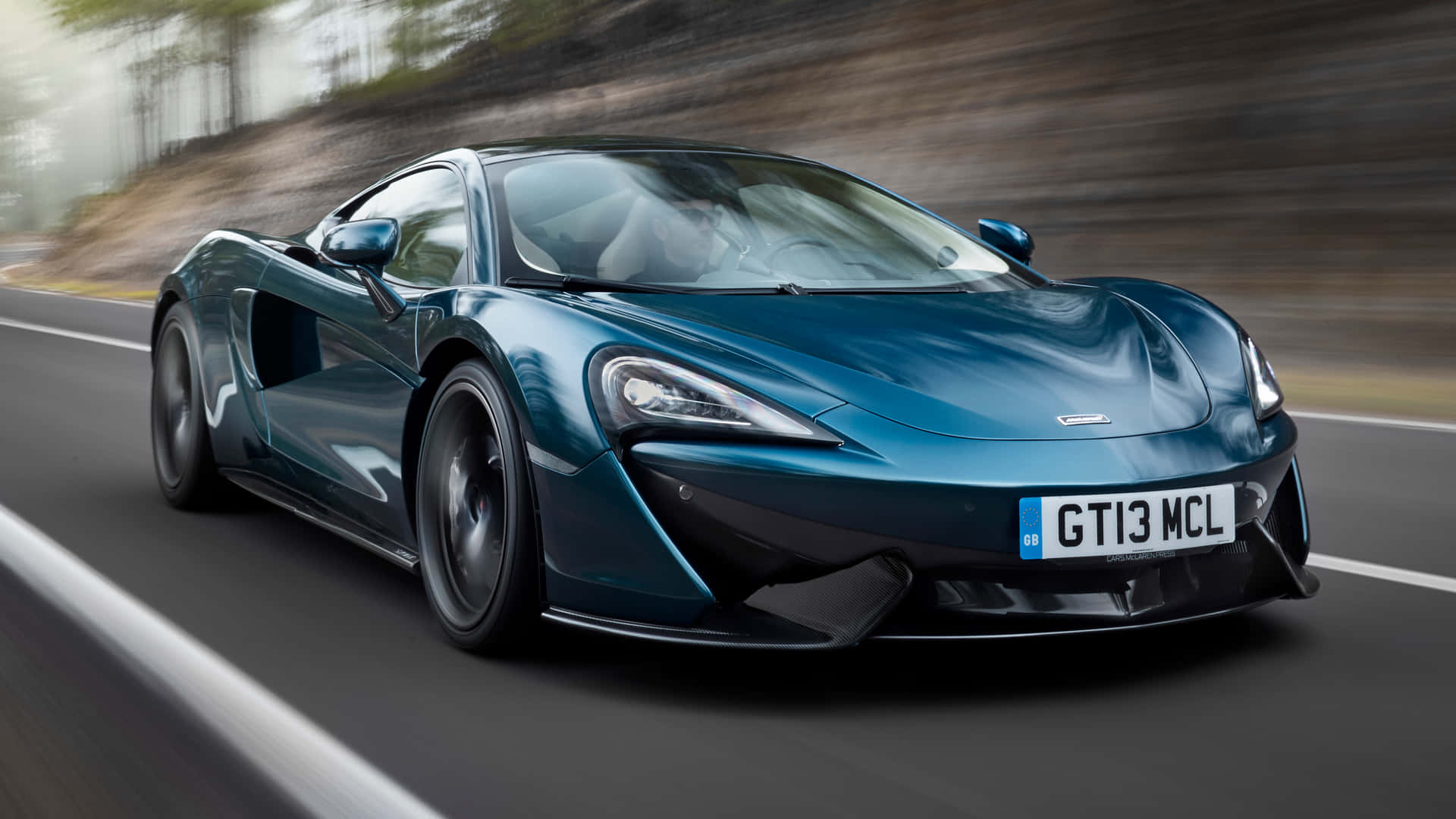 Download Supreme Vroom - Mclaren 570gt On The Move Wallpaper