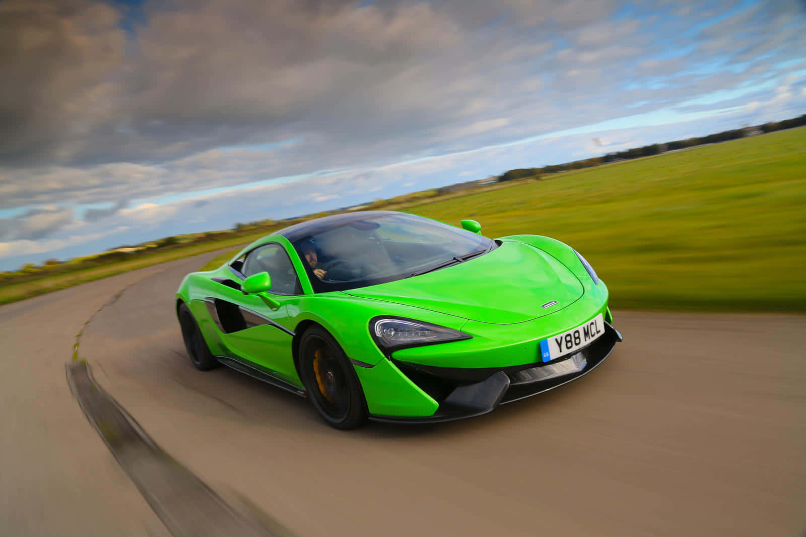 Majestic Mclaren 570s Showcasing Power And Style Wallpaper