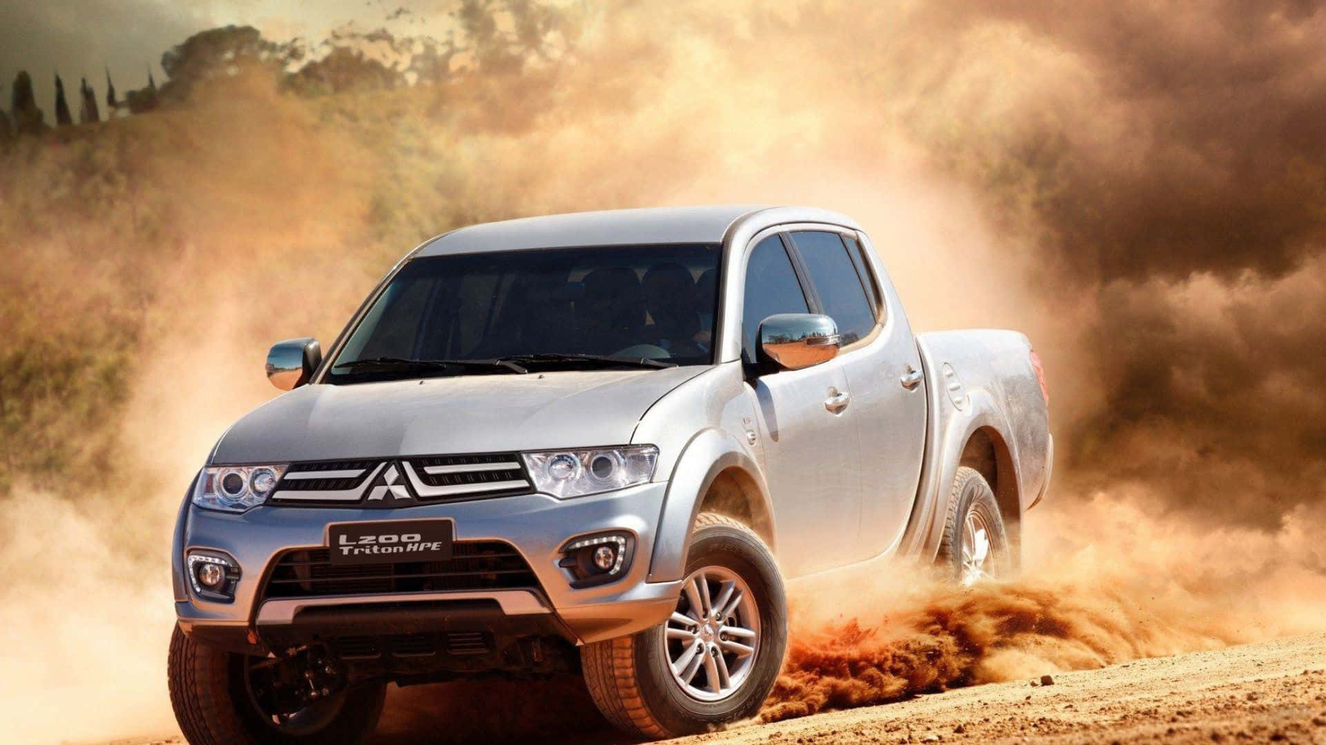 Majestic Mitsubishi Triton Dominating The Roadway Wallpaper