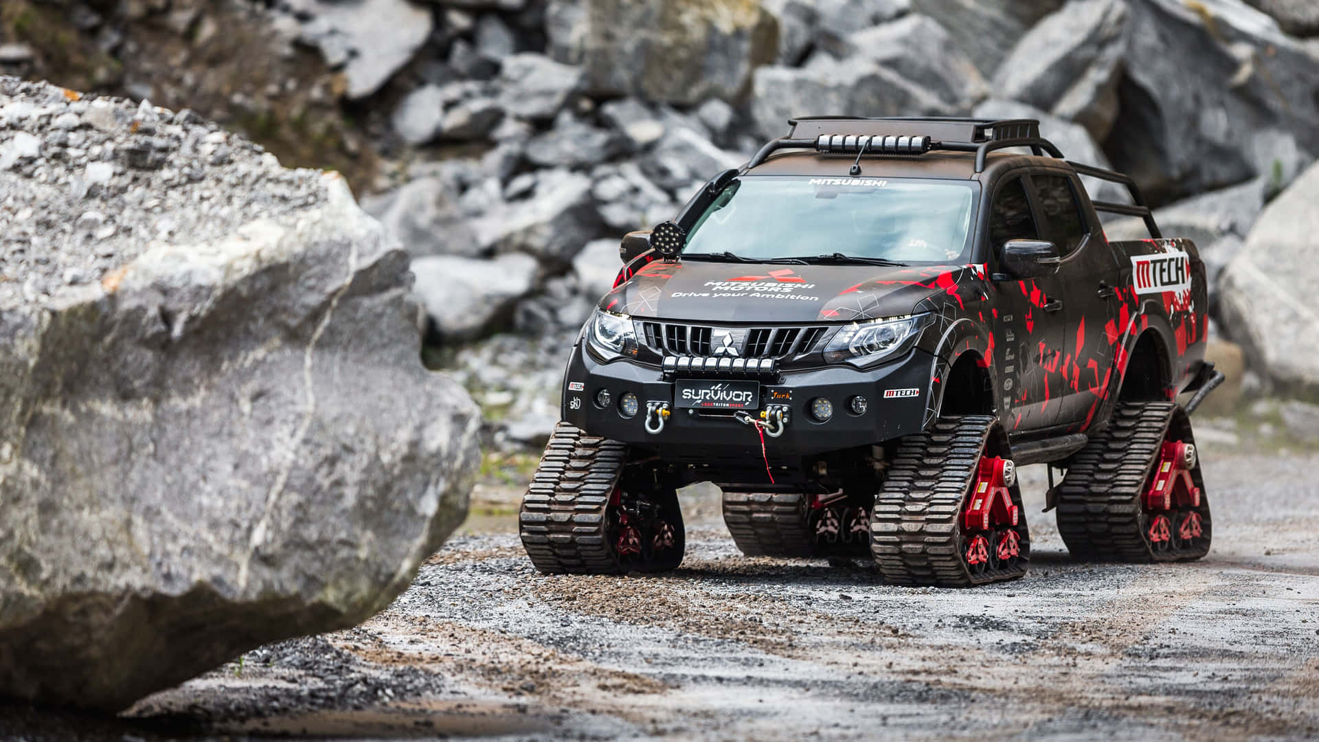 Majestic Mitsubishi Triton Exploring Uncharted Terrain Wallpaper