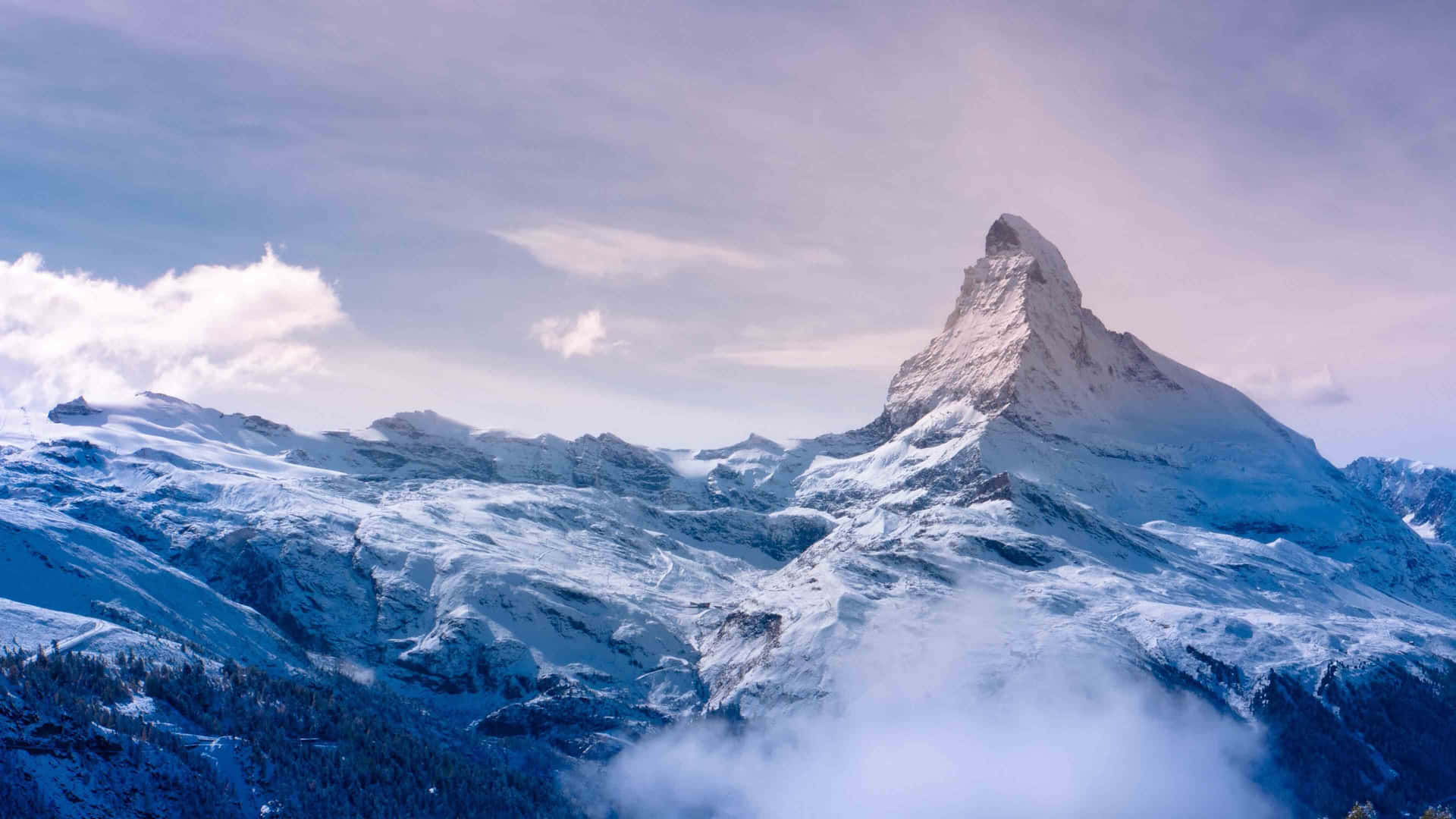Majestic_ Mountain_ Peak_ Above_ Clouds Wallpaper